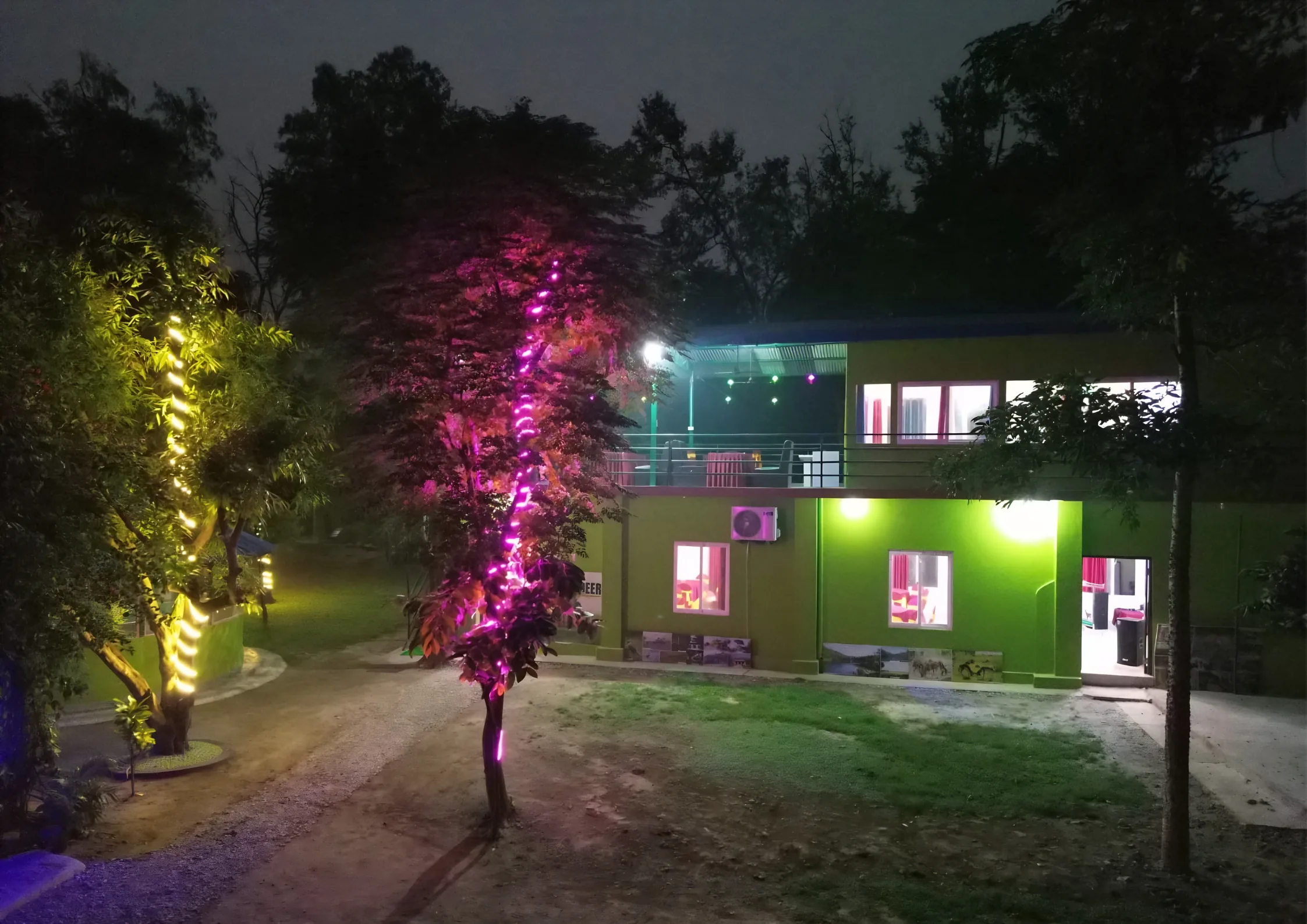 Shuklaphanta Jungle Cottage lit up at night